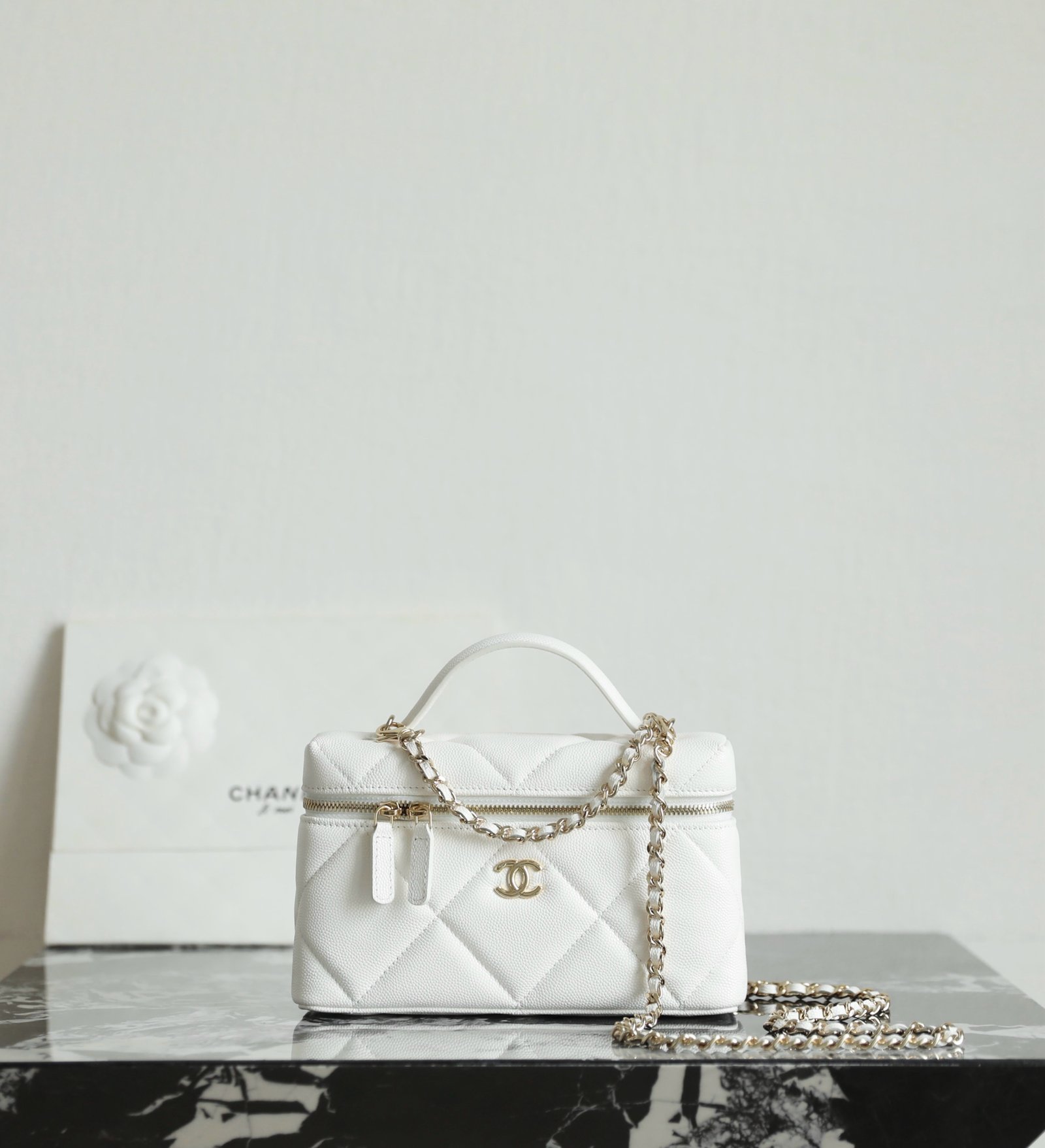 CHANEL Vanity Case with Chain – White Caviar Leather with 14K Light Gold Hardware detail image 1 sourced from womanlvbag.com