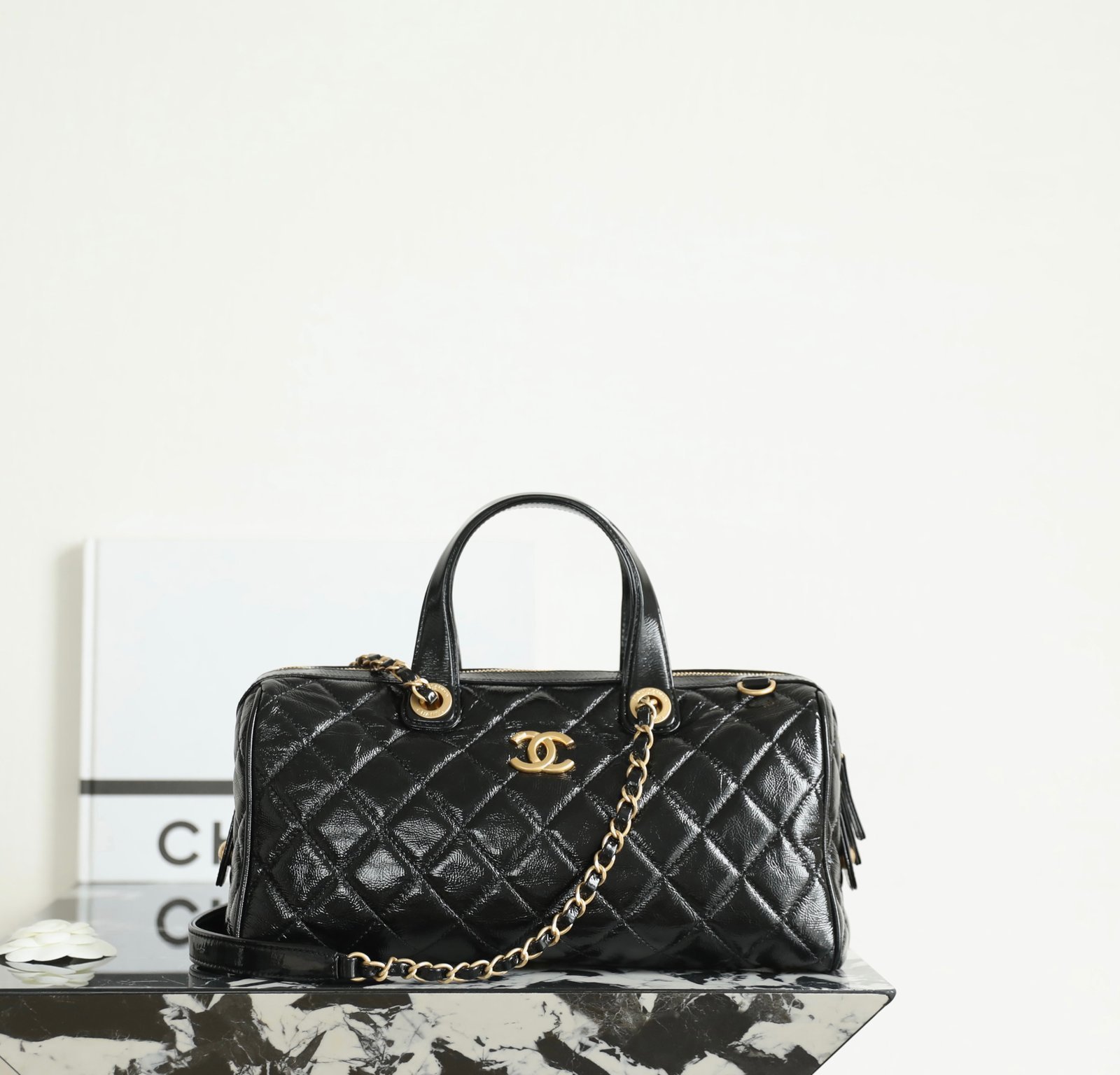 CHANEL Large Bowling Bag – Black Shiny Oil-Waxed Calfskin & 24K Vintage Gold detail image 1 sourced from womanlvbag.com