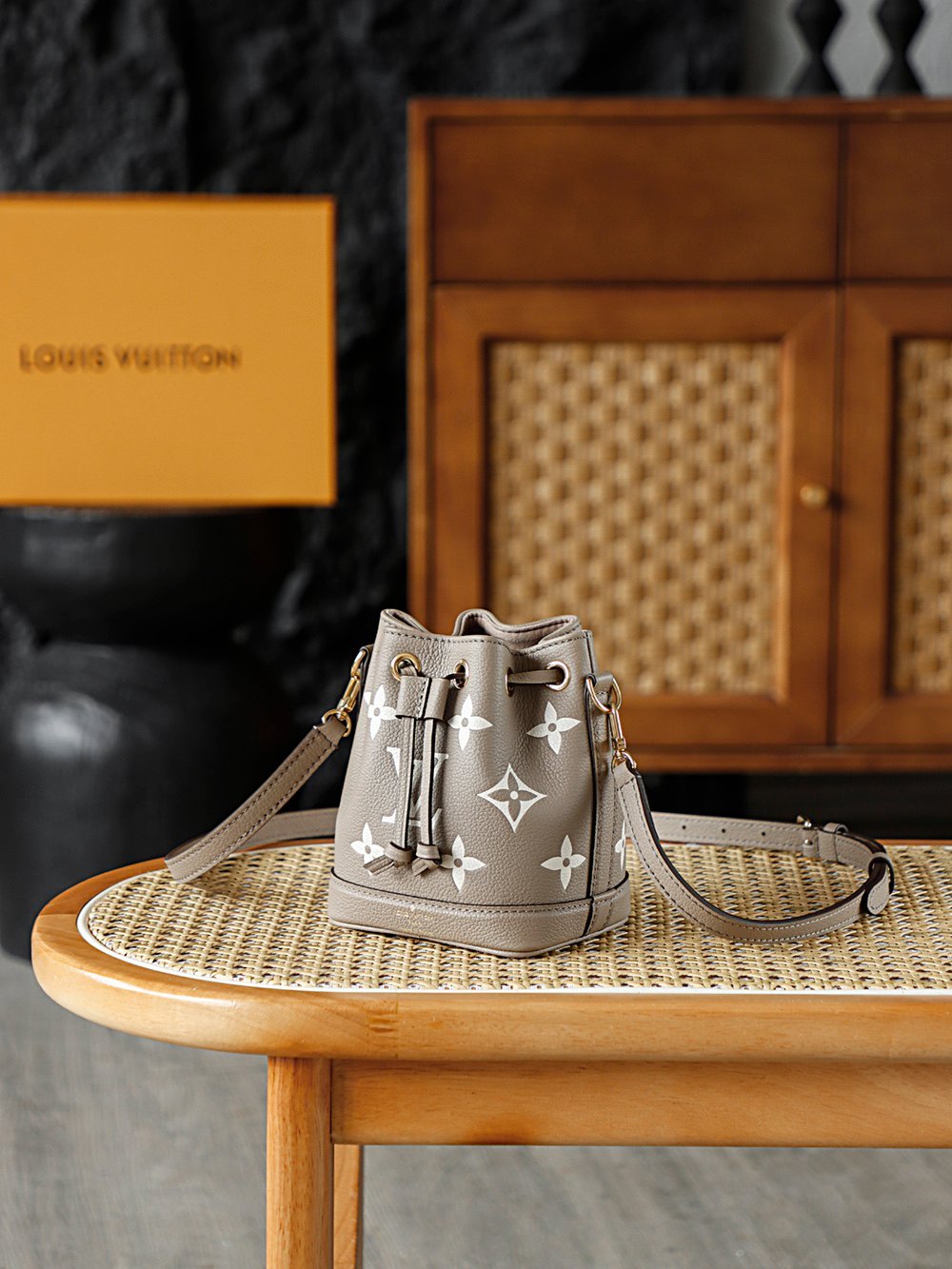 Louis Vuitton Nano Noé – Bicolor Monogram Empreinte in Tourterelle & Crème (M46291) detail image 2 sourced from womanlvbag.com