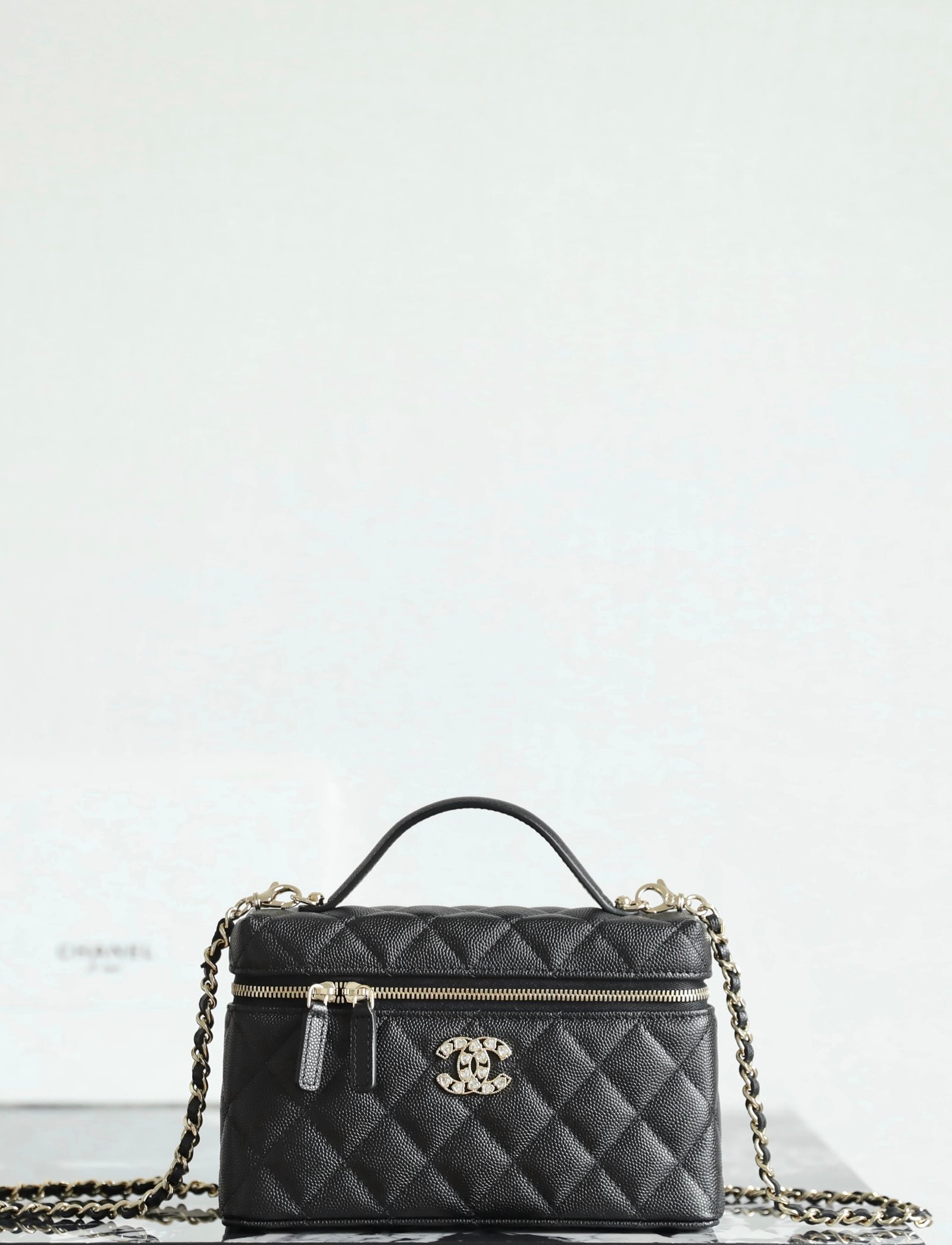 CHANEL Vanity Case with Chain – Black Caviar Leather with 14K Light Gold Heart-Crystal Hardware detail image 1 sourced from womanlvbag.com