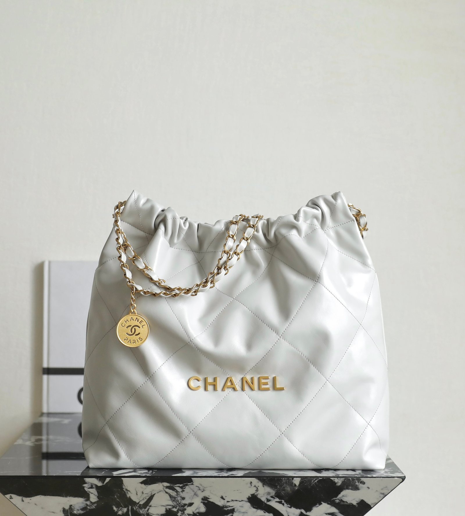 CHANEL Medium 22 Bag – Light Grey Calfskin Leather with 24K Vintage Gold Hardware detail image 1 sourced from womanlvbag.com