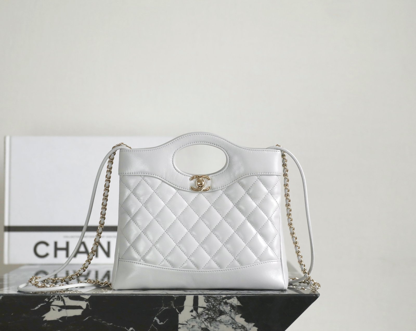 CHANEL 31 Nano Shopping Bag, a compact version of the archival '31' silhouette detail image 1 sourced from womanlvbag.com