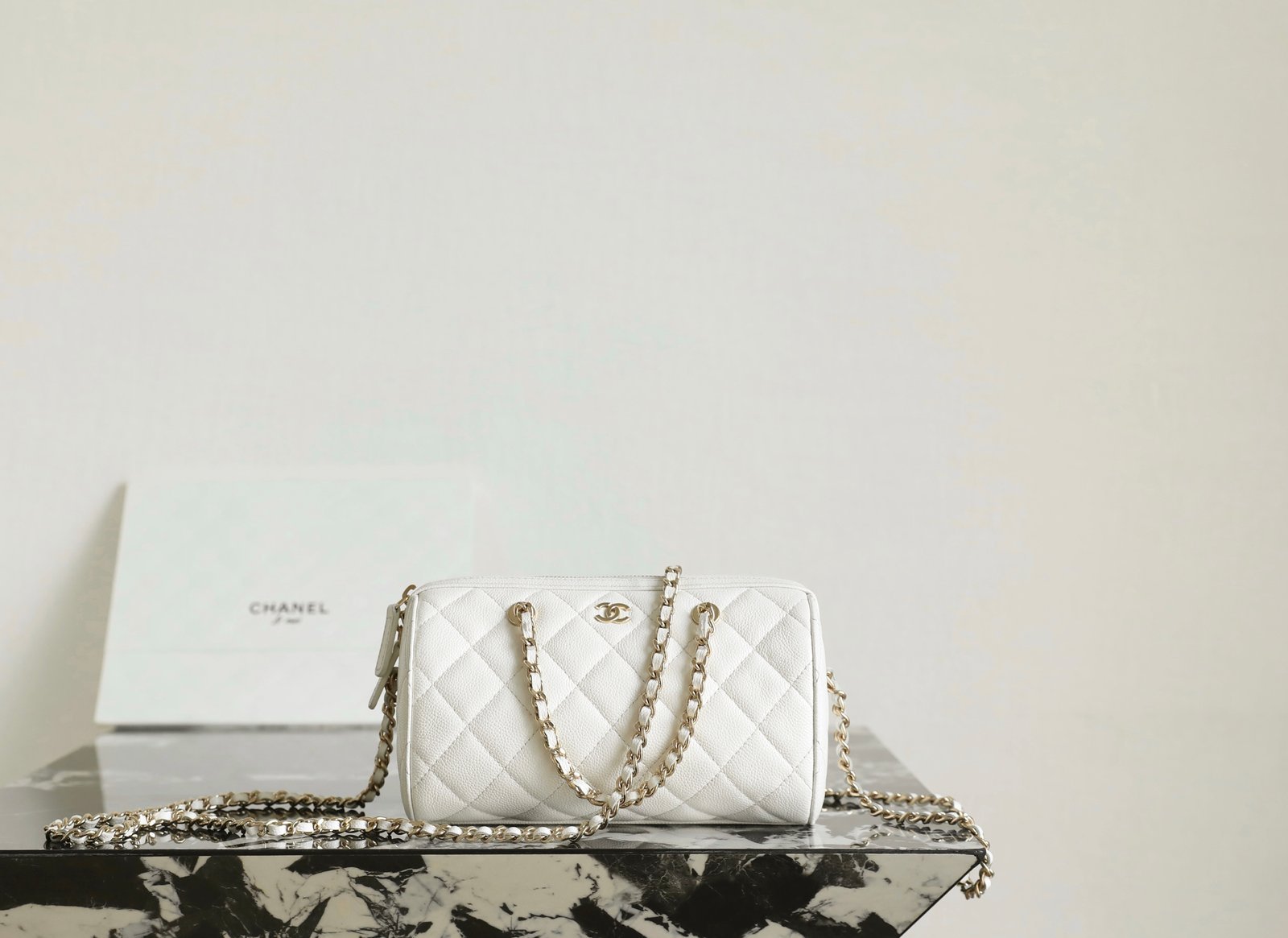 CHANEL Mini Bowling Bag – White Caviar & 14K Light Gold detail image 1 sourced from womanlvbag.com