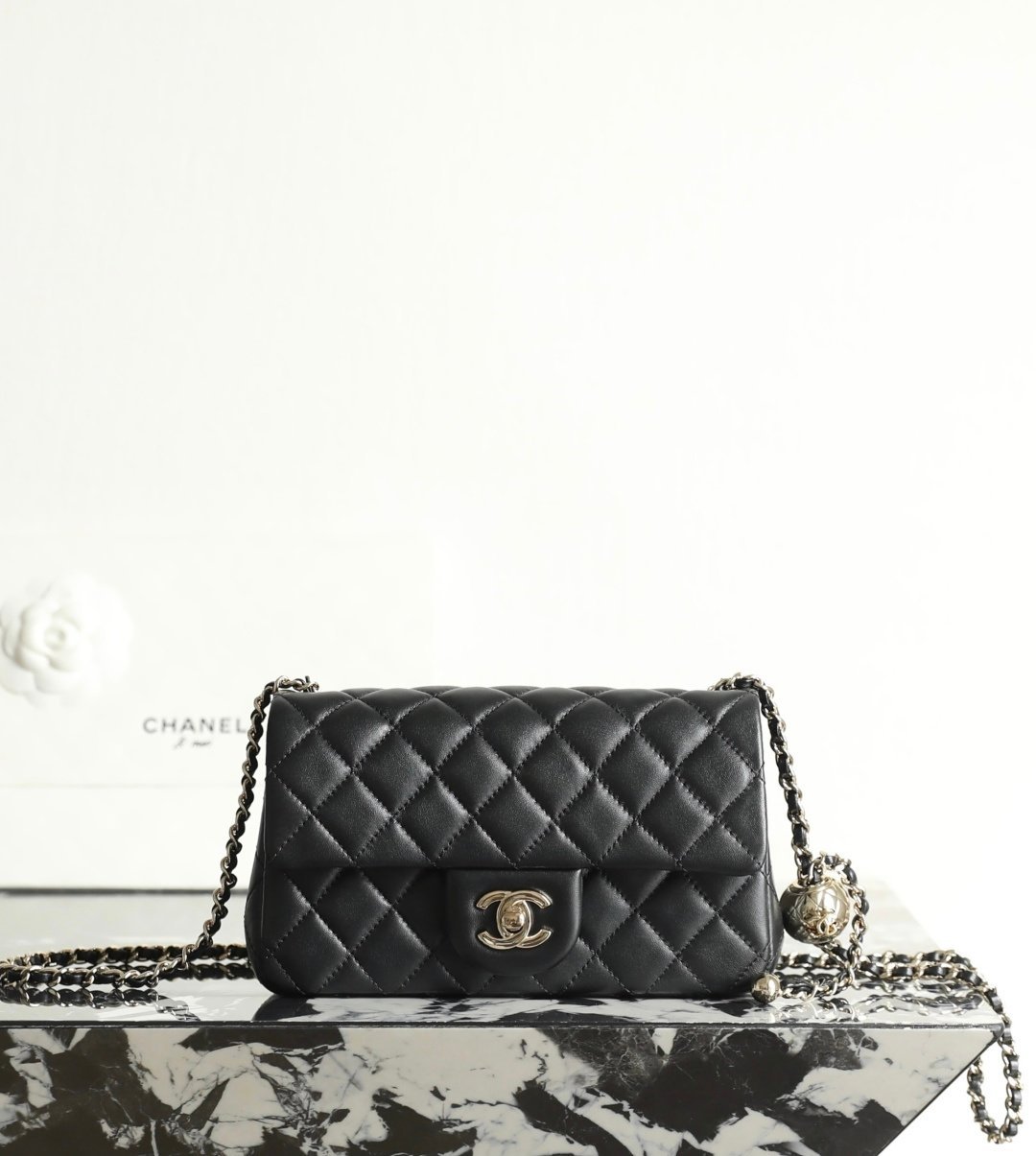 CHANEL Large Mini "Golden Ball" Adjustable Flap Bag – Black Lambskin with 14K Light Gold Hardware detail image 1 sourced from womanlvbag.com