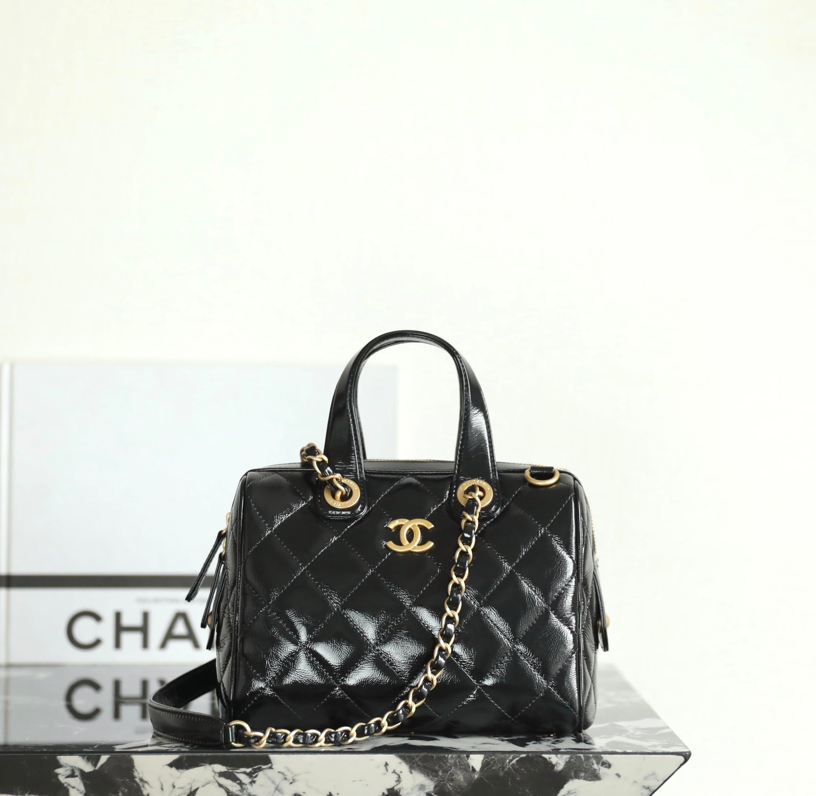 CHANEL Small Bowling Bag – Black Shiny Oil-Waxed Calfskin detail image 1 sourced from womanlvbag.com
