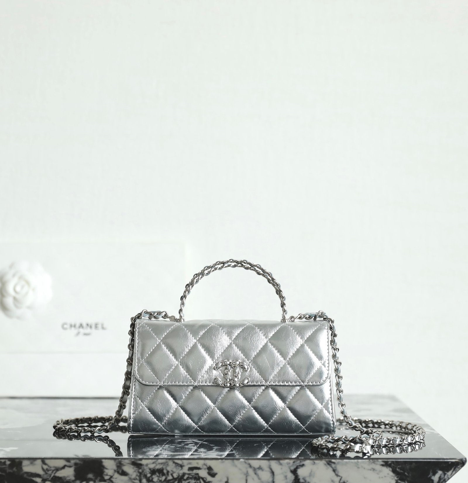 CHANEL Mini Kelly Crisscross Handle Flap Bag – Metallic Silver Caviar with 14K Light Gold Hardware detail image 1 sourced from womanlvbag.com