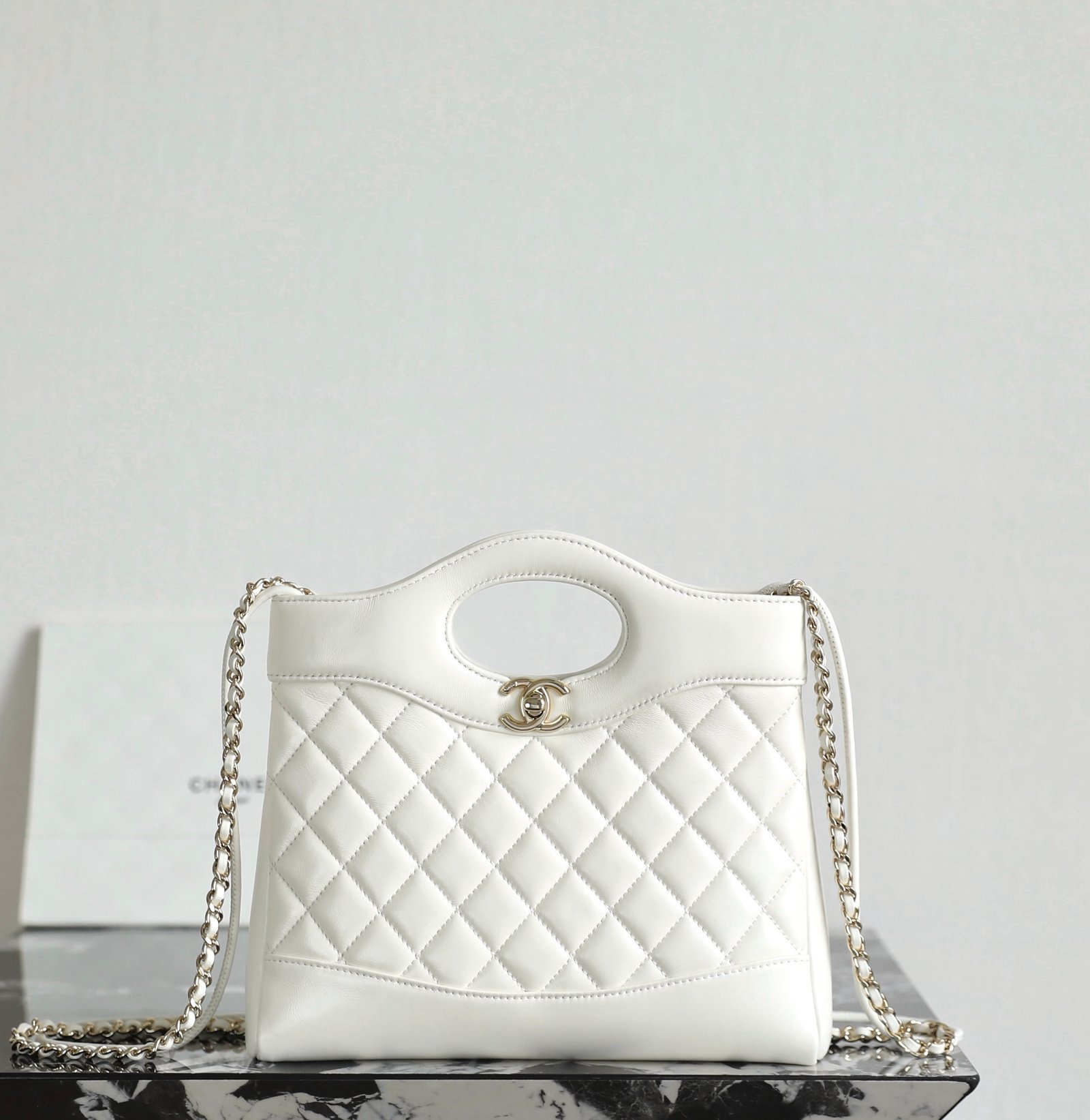 CHANEL 31 Nano Shopping Bag – White Lambskin with 14K Light Gold Hardware detail image 1 sourced from womanlvbag.com