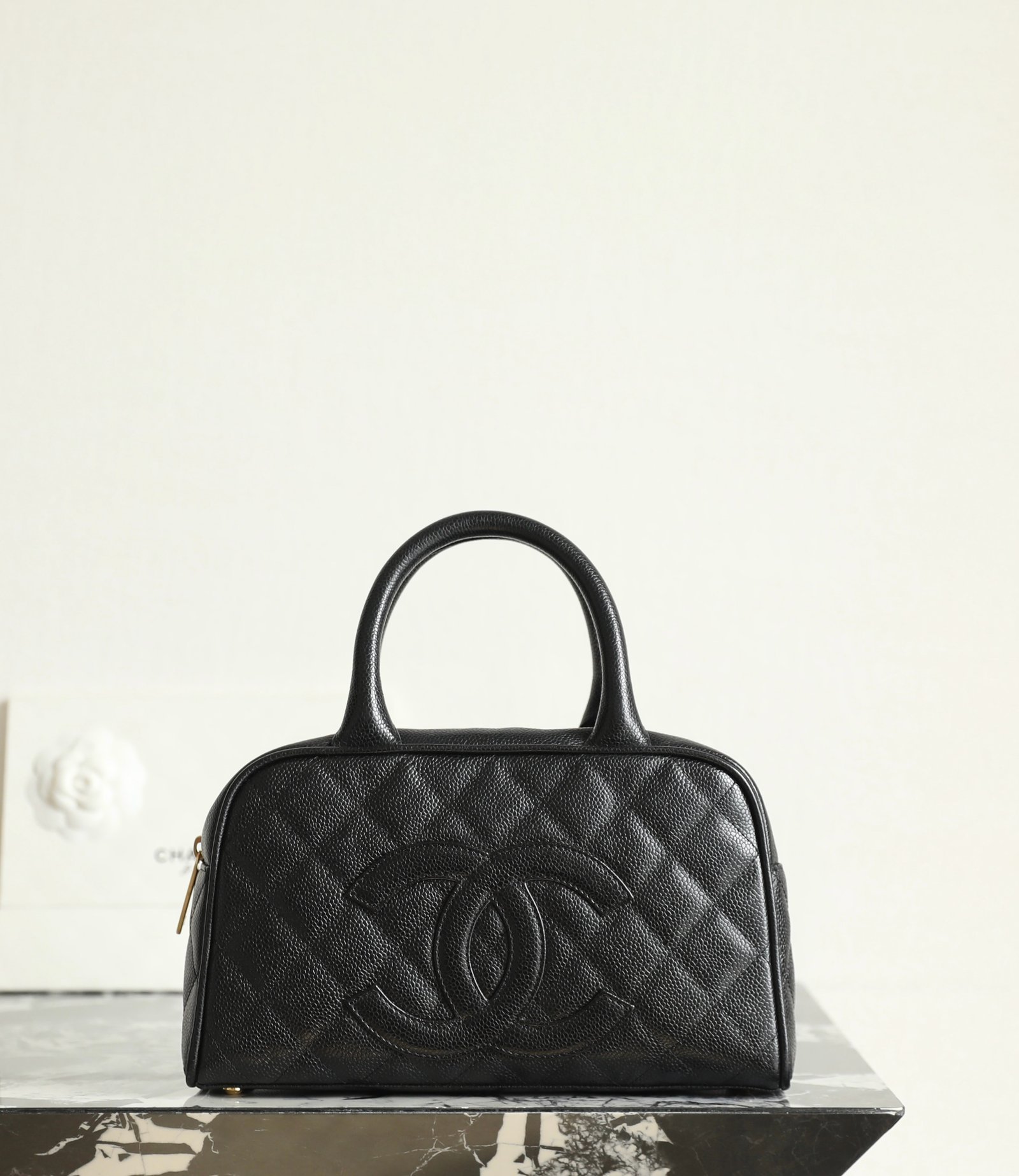 CHANEL Quilted CC Bowling Bag – Black Caviar & 24K Shiny Gold detail image 1 sourced from womanlvbag.com