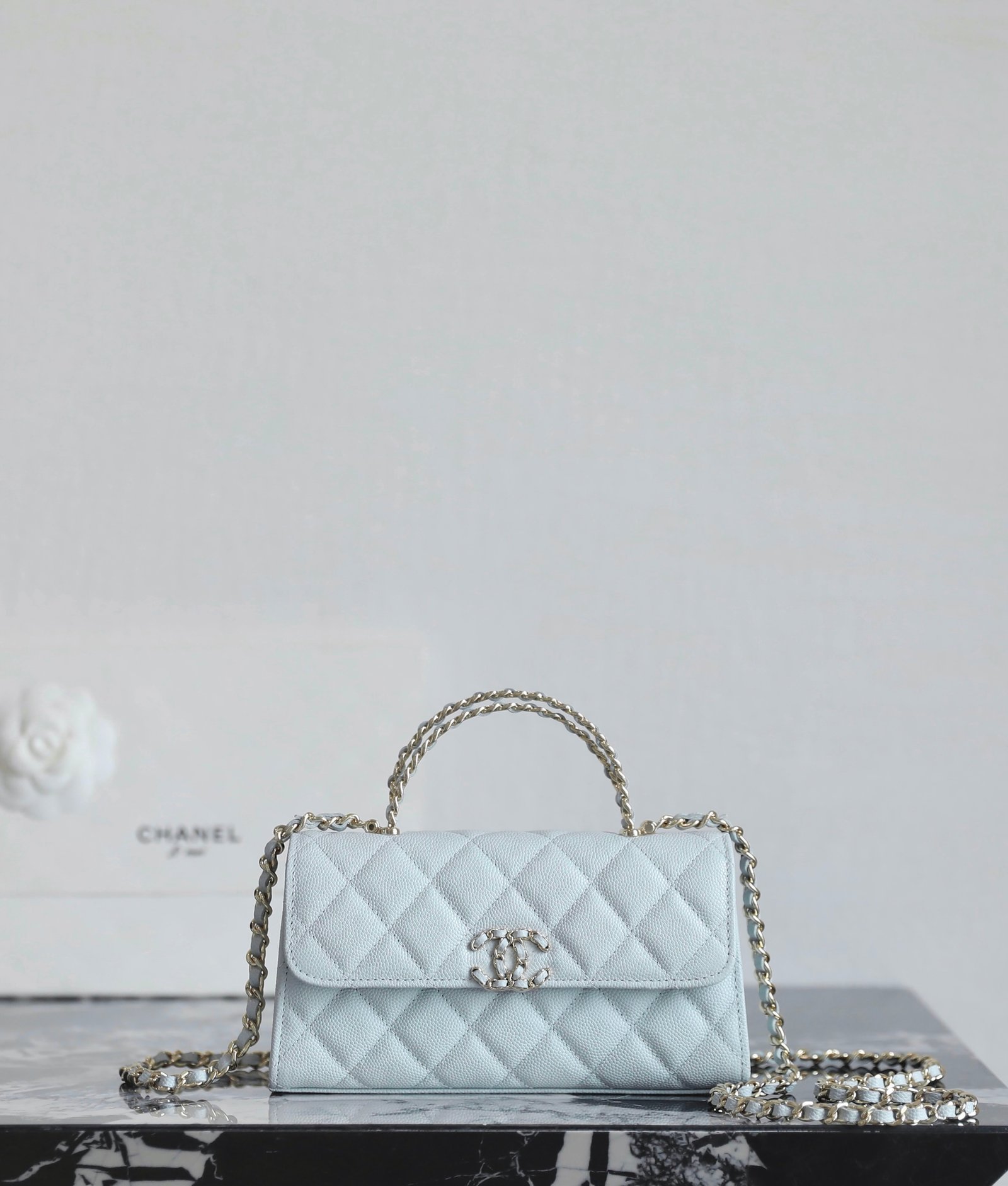CHANEL Mini Kelly Crisscross Handle Chain Bag – Light Blue Caviar with 14K Light Gold Hardware detail image 1 sourced from womanlvbag.com