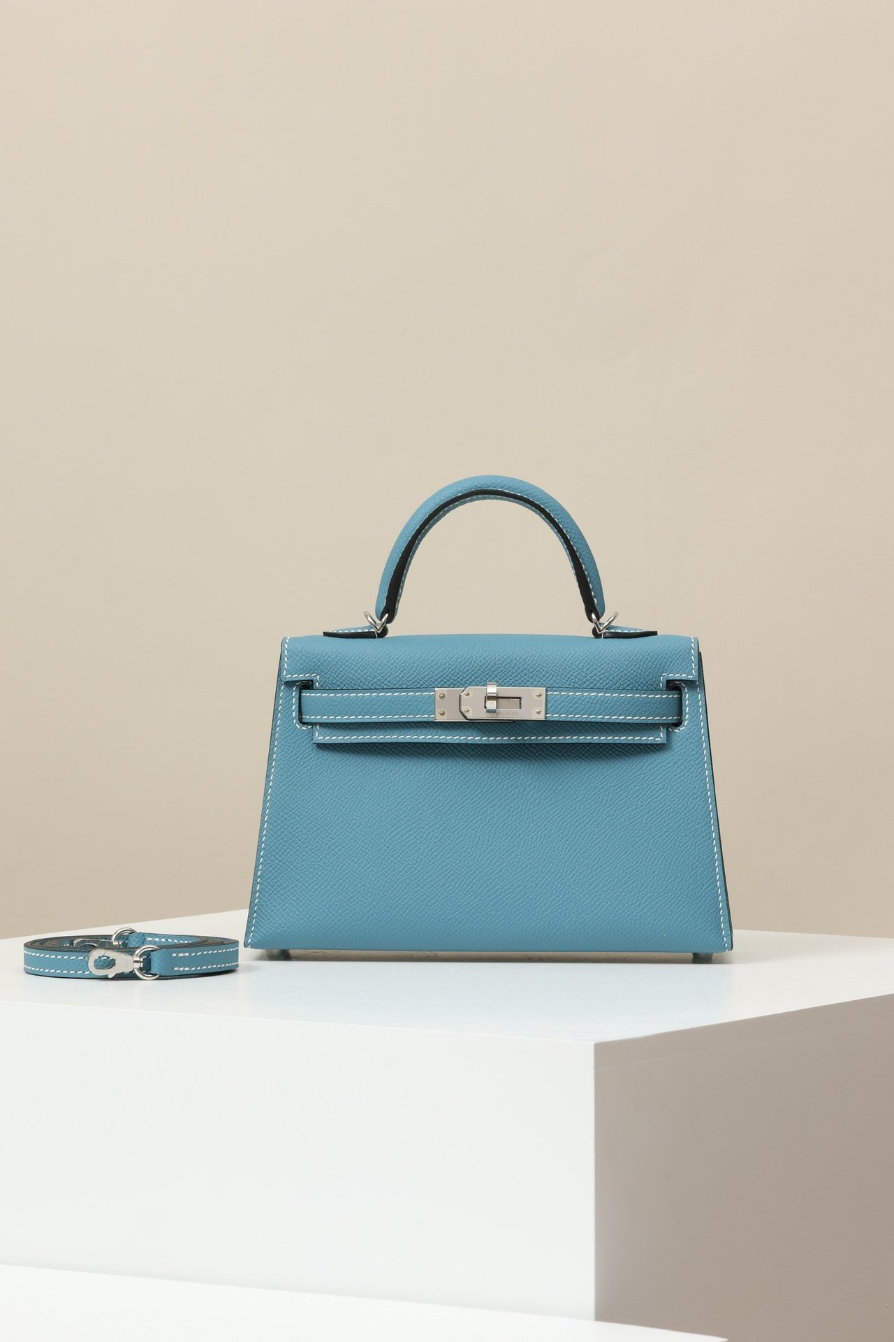 Hermès Mini Kelly 19 Sellier G2 Epsom Bleu Jean D2 Palladium Hardware (PHW) comparison image 1 sourced from womanlvbag.com