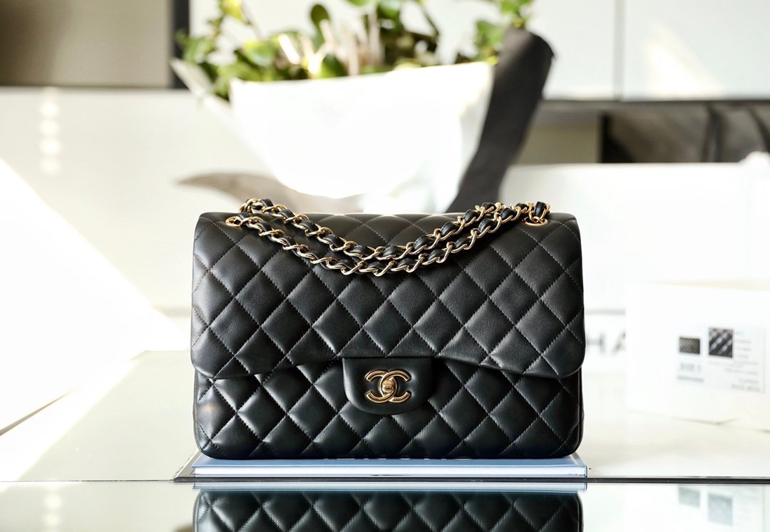 CHANEL Jumbo Classic Double Flap Bag – Black Lambskin Leather with 24K Shiny Gold Hardware detail image 1 sourced from womanlvbag.com