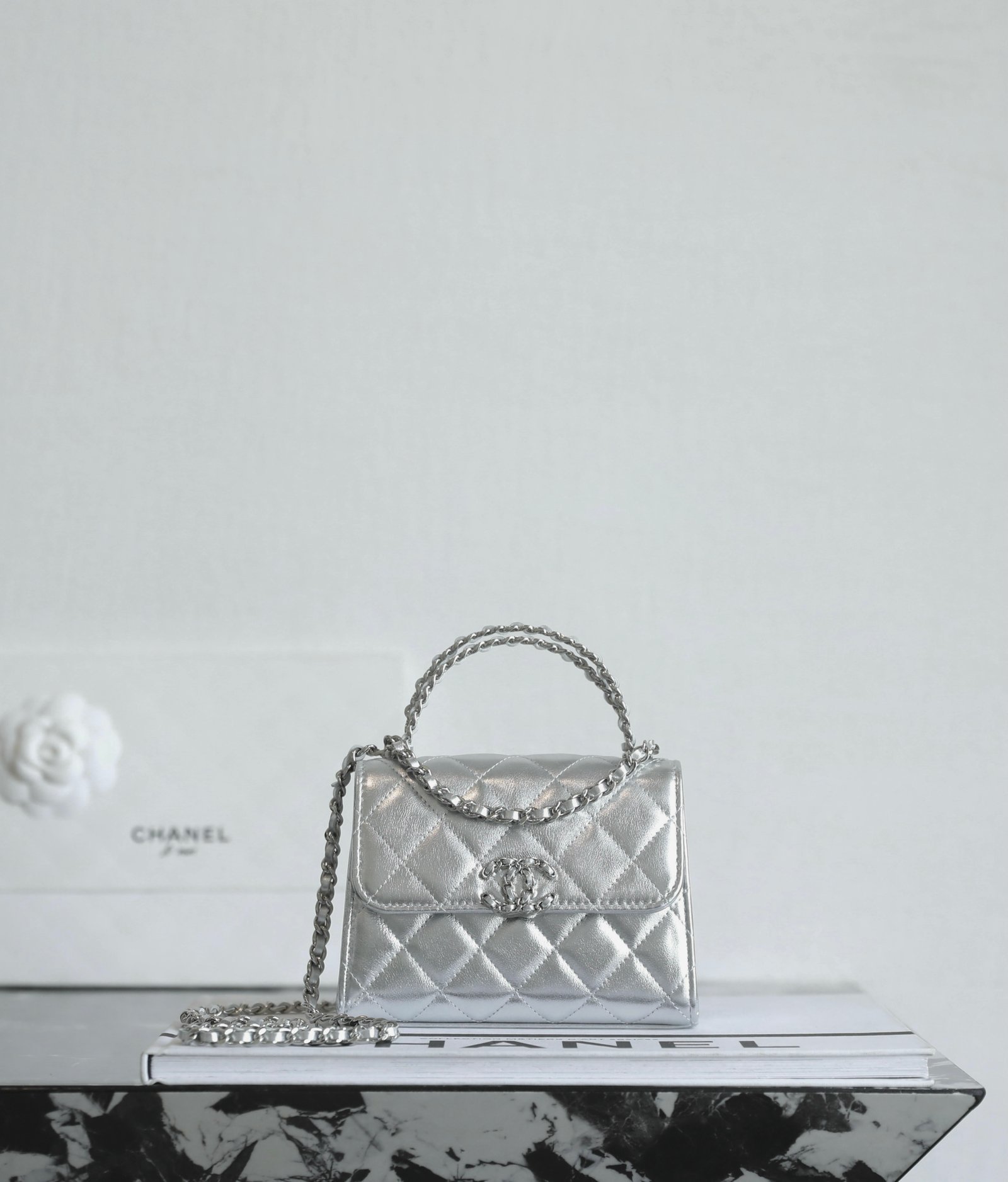 CHANEL Mini Small Kelly Crisscross Handle Flap Bag – Metallic Silver Caviar with 14K Light Gold Hardware detail image 1 sourced from womanlvbag.com