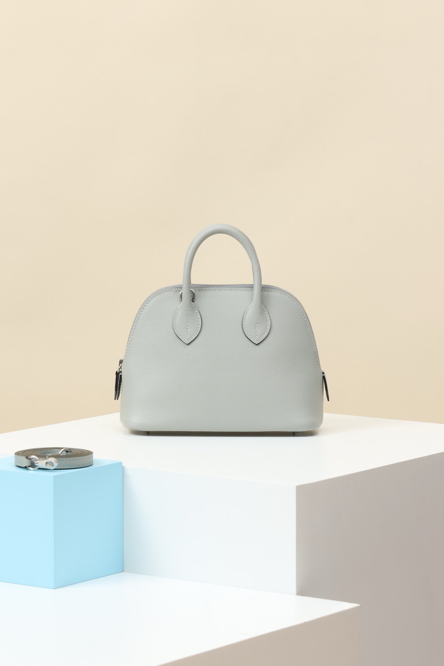Hermès Mini Bolide 1923 18 – Evercolor Calfskin 8U Bleu Glacier PHW comparison image 1 sourced from womanlvbag.com