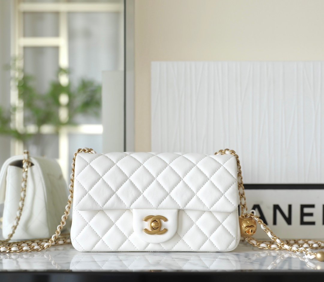 CHANEL Large Mini "Golden Ball" Adjustable Flap Bag – White Lambskin with 24K Vintage Gold Hardware detail image 1 sourced from womanlvbag.com