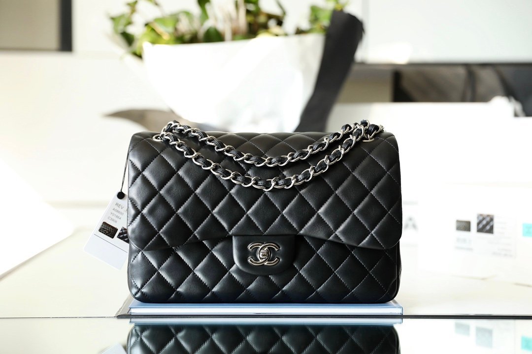 CHANEL Jumbo Classic Double Flap Bag – Black Lambskin Leather with Silver-Tone Hardware detail image 1 sourced from womanlvbag.com